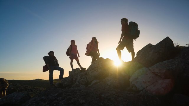 Some travelers carrying durable sustainable backpacks for adventure