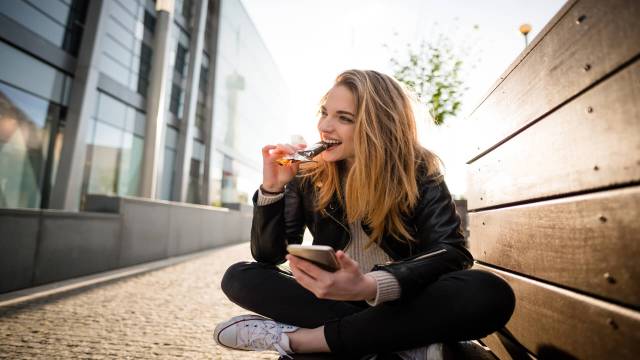 Person eating Sustainable snacks