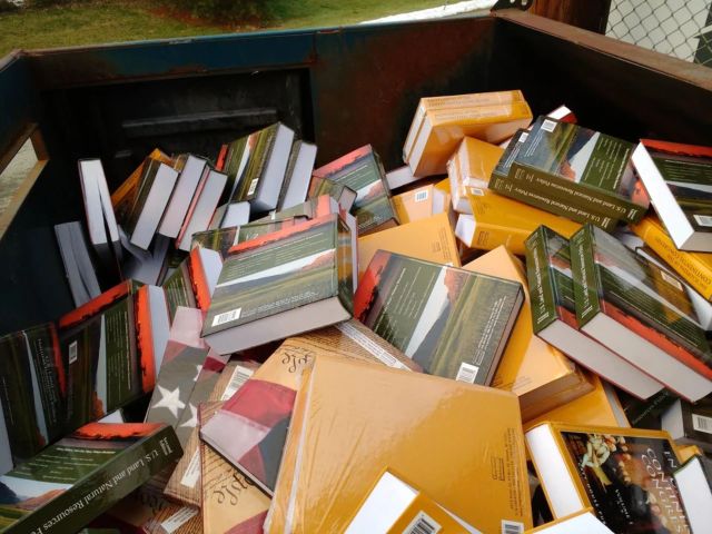 Publishing company's discarded pile of brand new books
