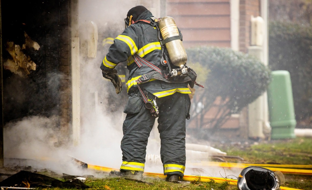 The fire grew to about 100 acres at one point, destroying at least five homes and damaging three others.