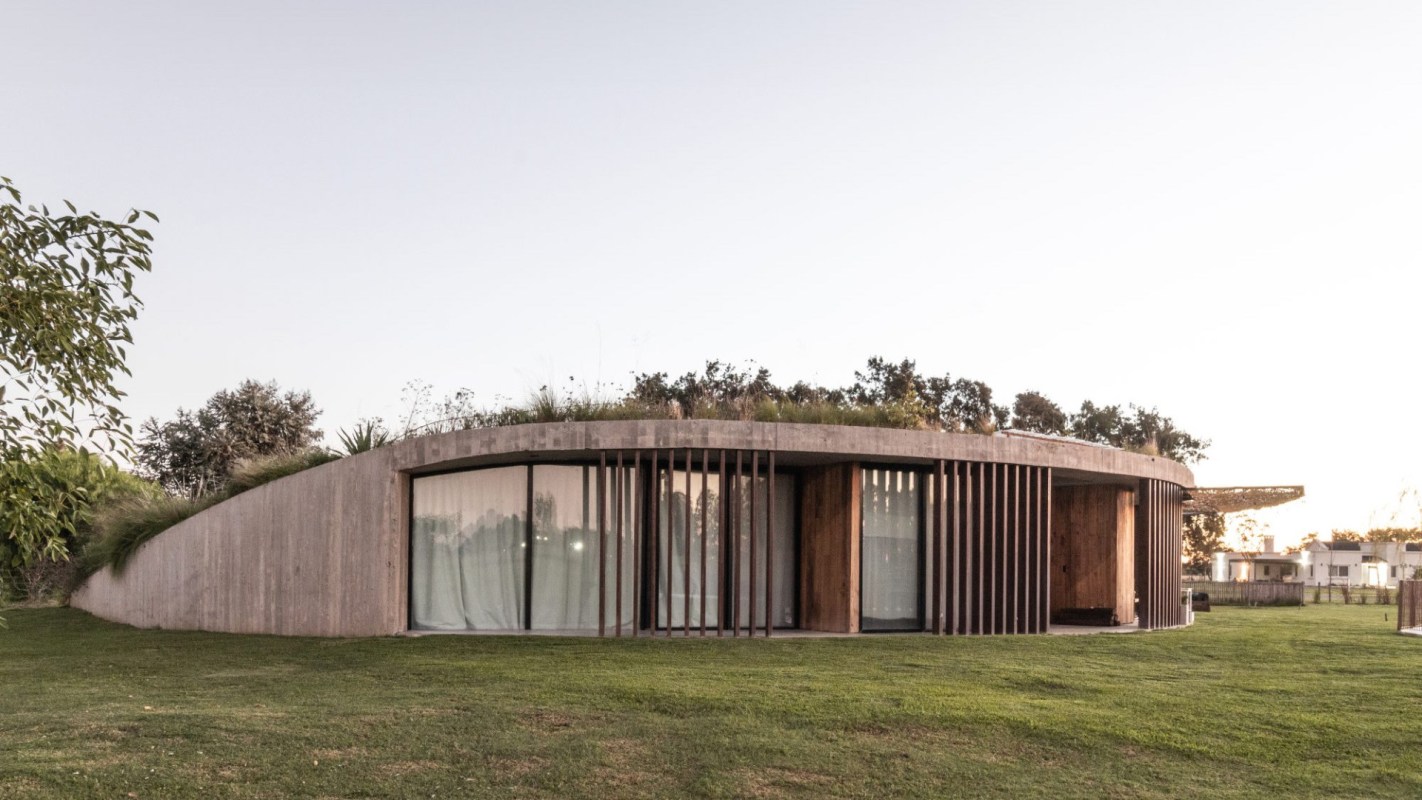 Mosquera's concrete home design demonstrates the potential of self-sufficient homes and the benefits of houses that produce their own energy, utilize energy-efficient features, and blend into the natural environment.