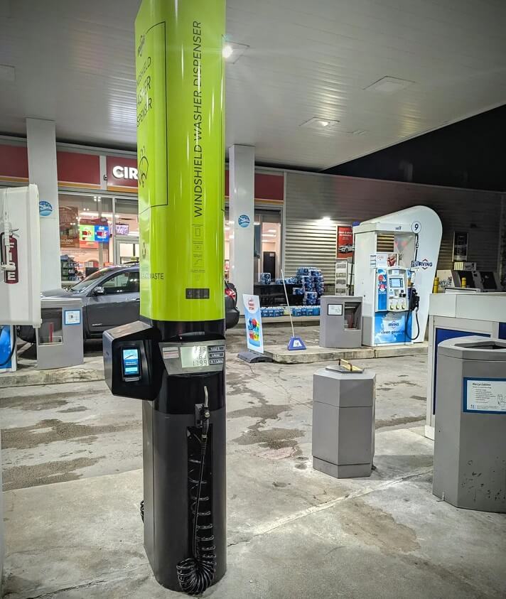 The bright green dispenser works just like a regular gas pump and enables you to fill your wiper fluid reservoir directly.