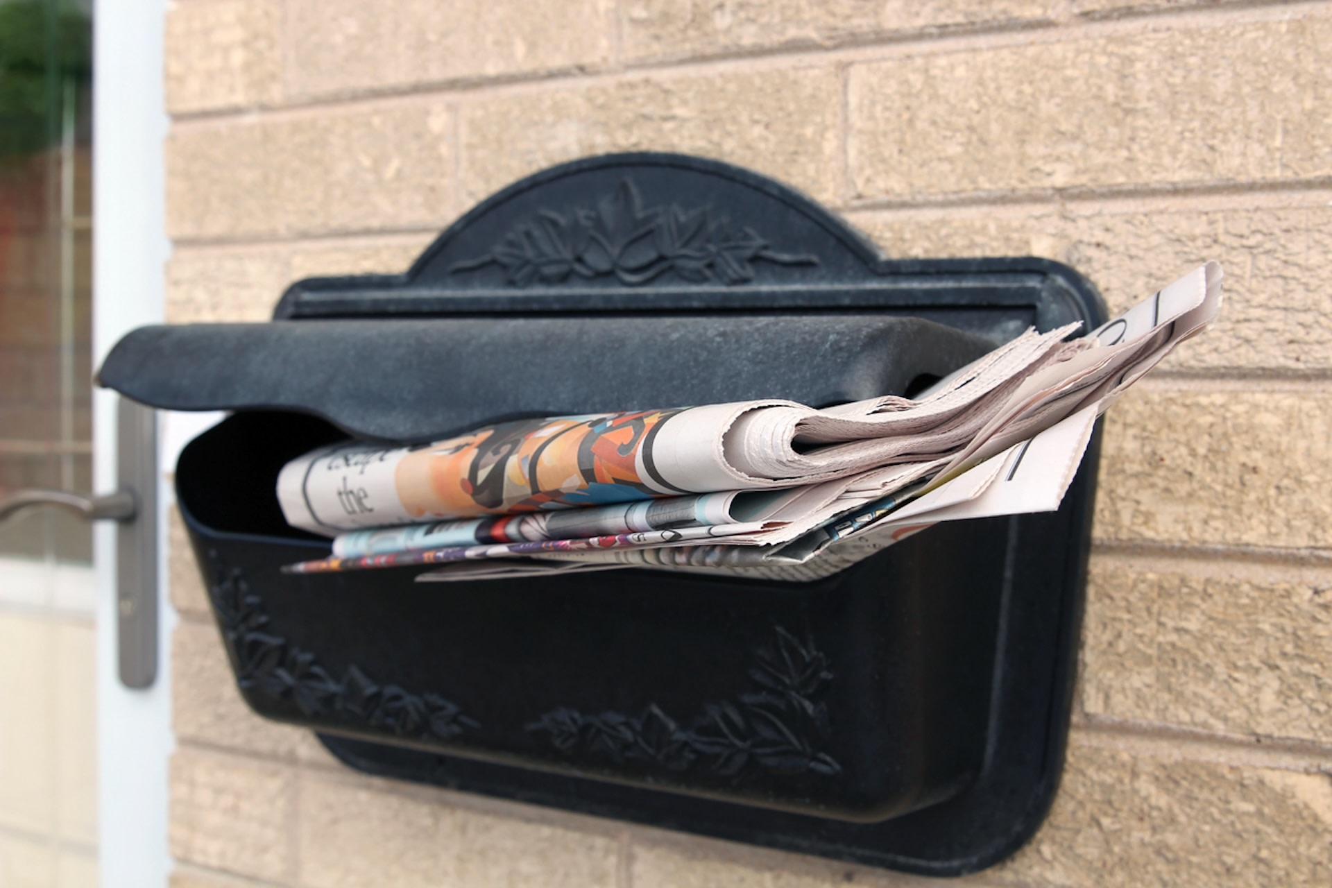 mail hanging out of mailbox