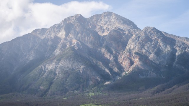 The helicopter that airlifted the hikers had to leave a wildfire it was fighting for about three hours.