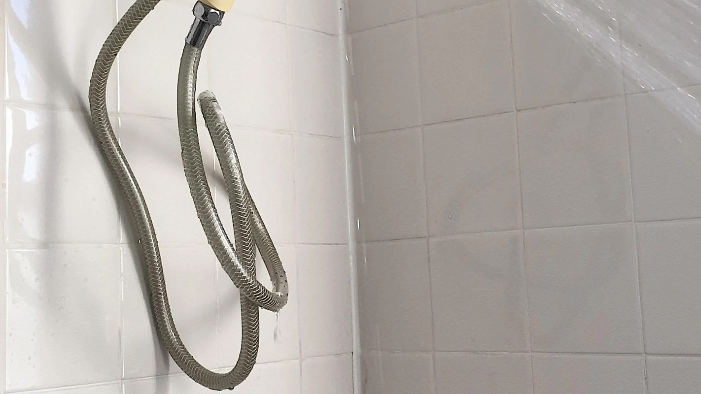 A shower stall with a showerhead.