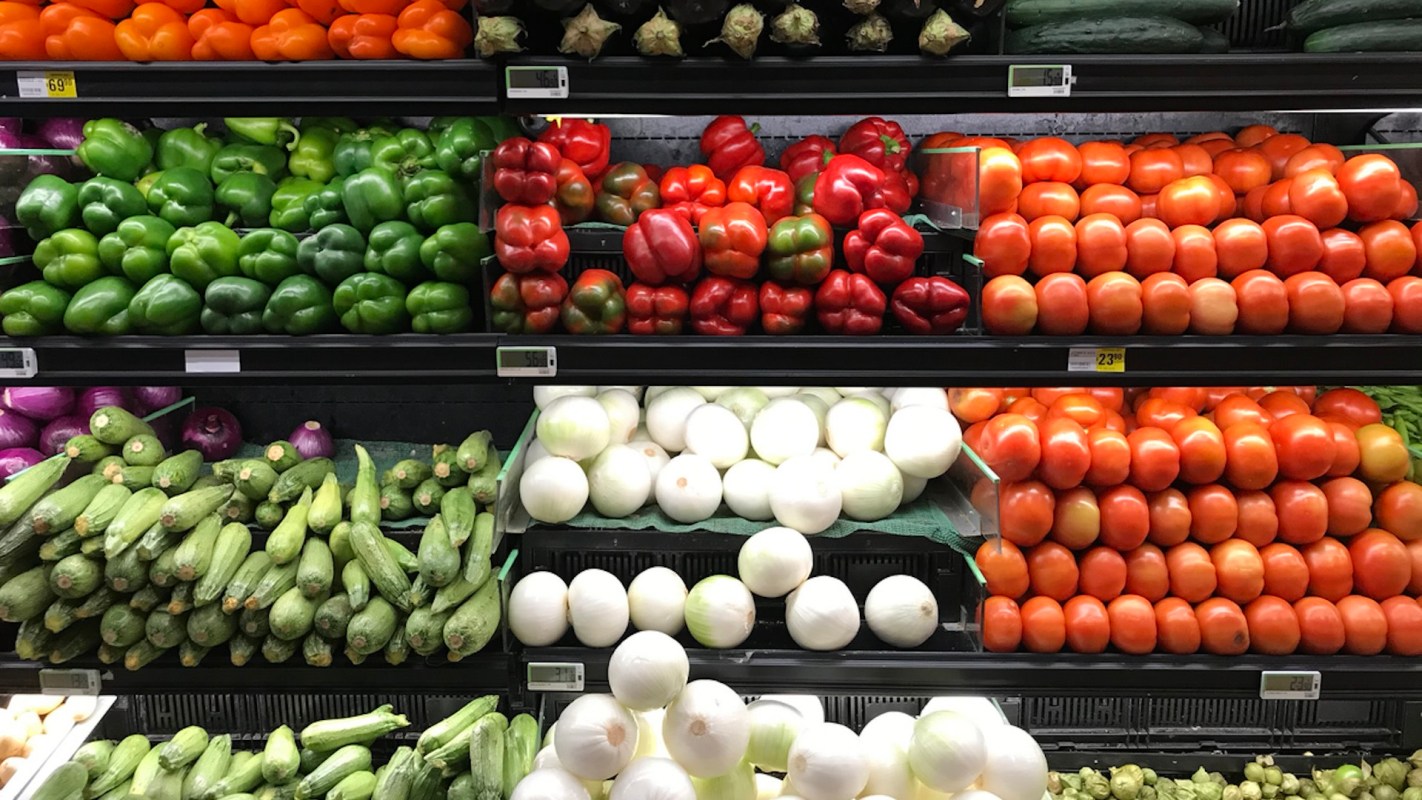 The produce section of the grocery store, featuring vegetables.