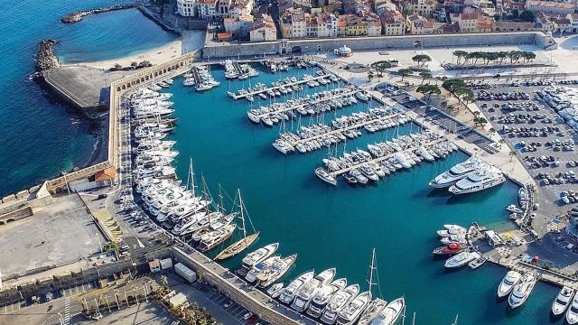 The yacht appears to be docked at a marina in a special area away from smaller boats.